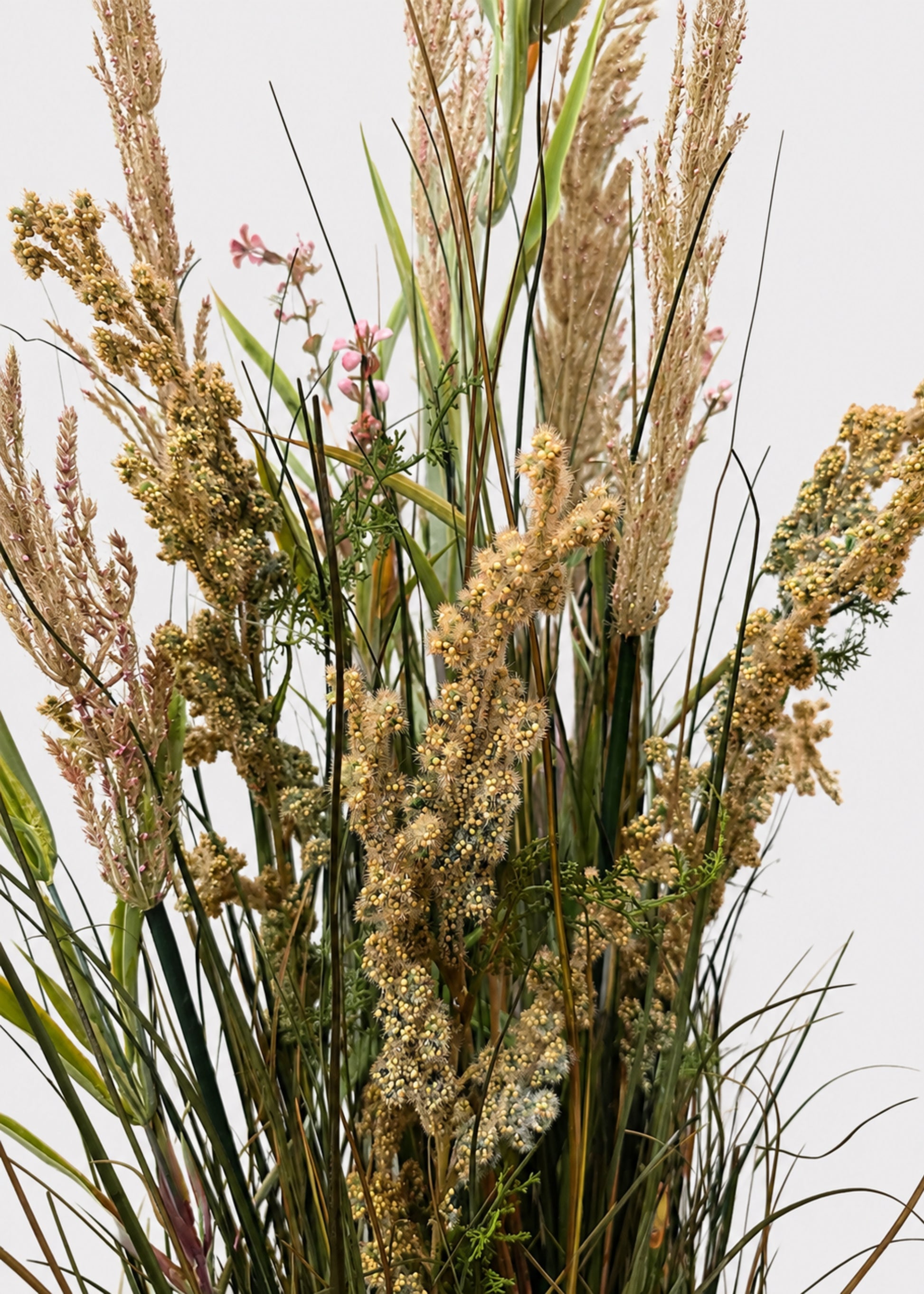 Close-up of a Large Green and Brown Fake Field Grass Potted Plant