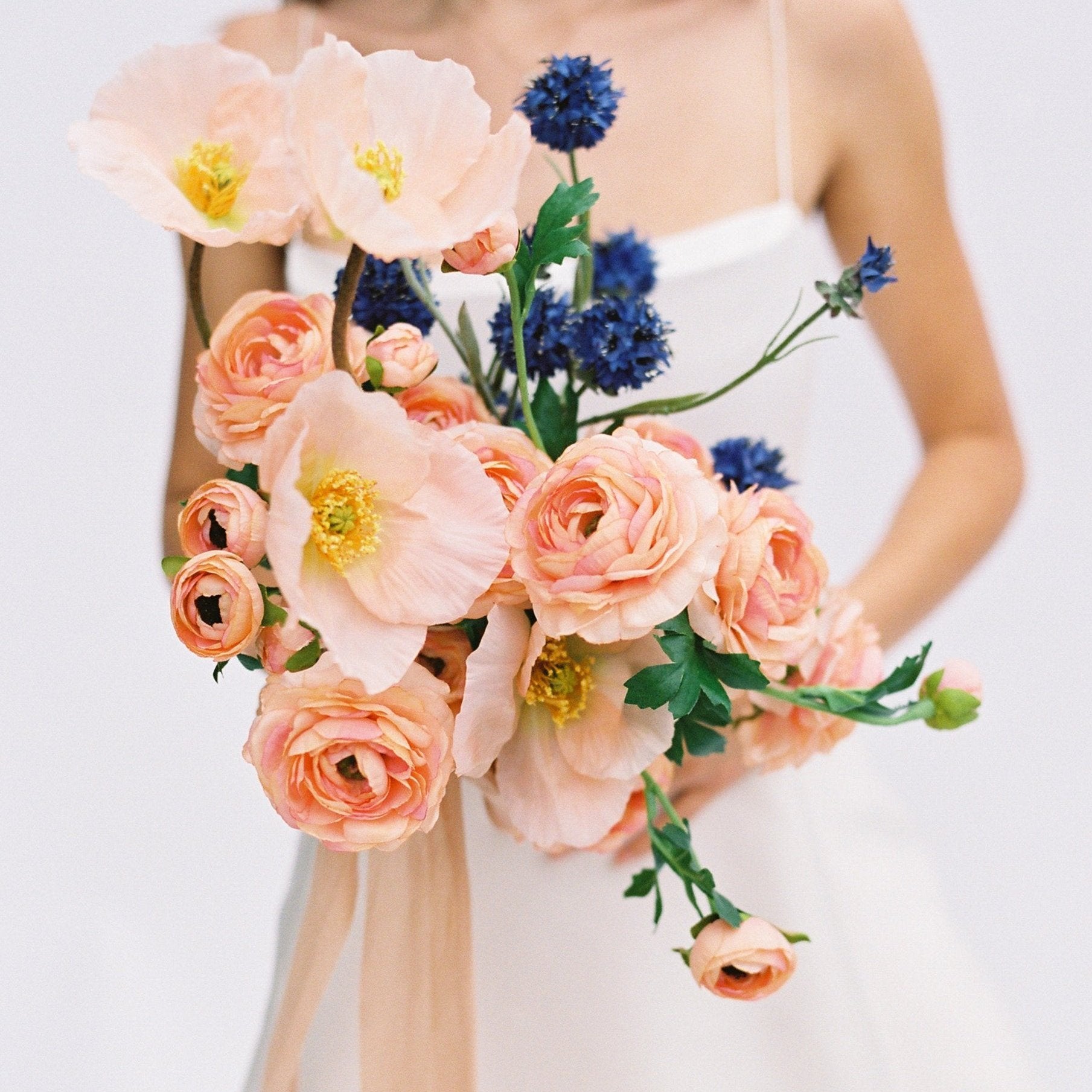 peach wedding bouquet made of silk flowers