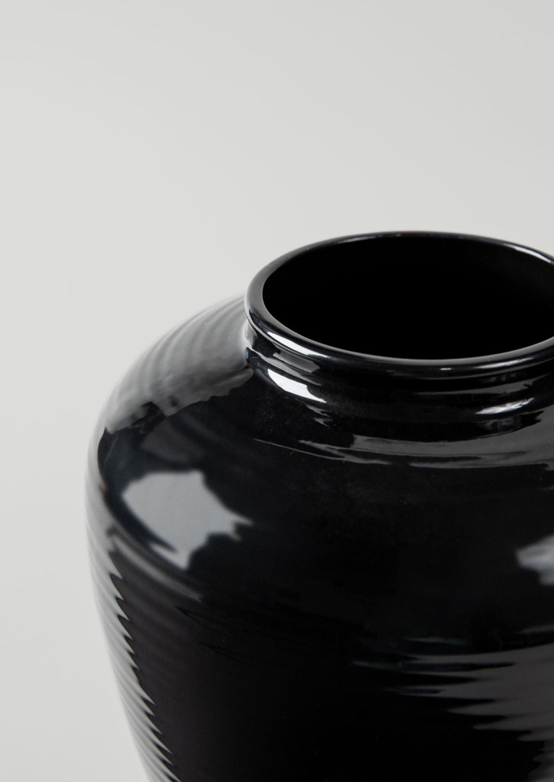 Close-up of the Exclusive Glazed Noir Ribbed Stoneware Table Vase at Afloral