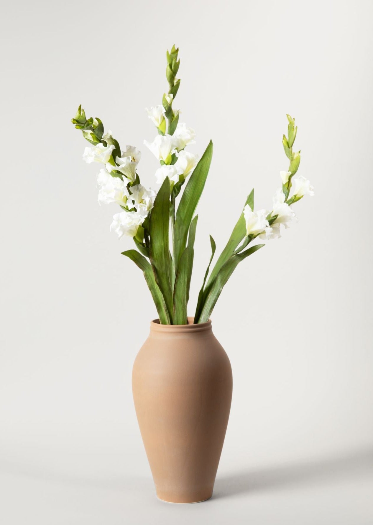 White Faux Gladiolus Flowers in Medium Terracotta Vase