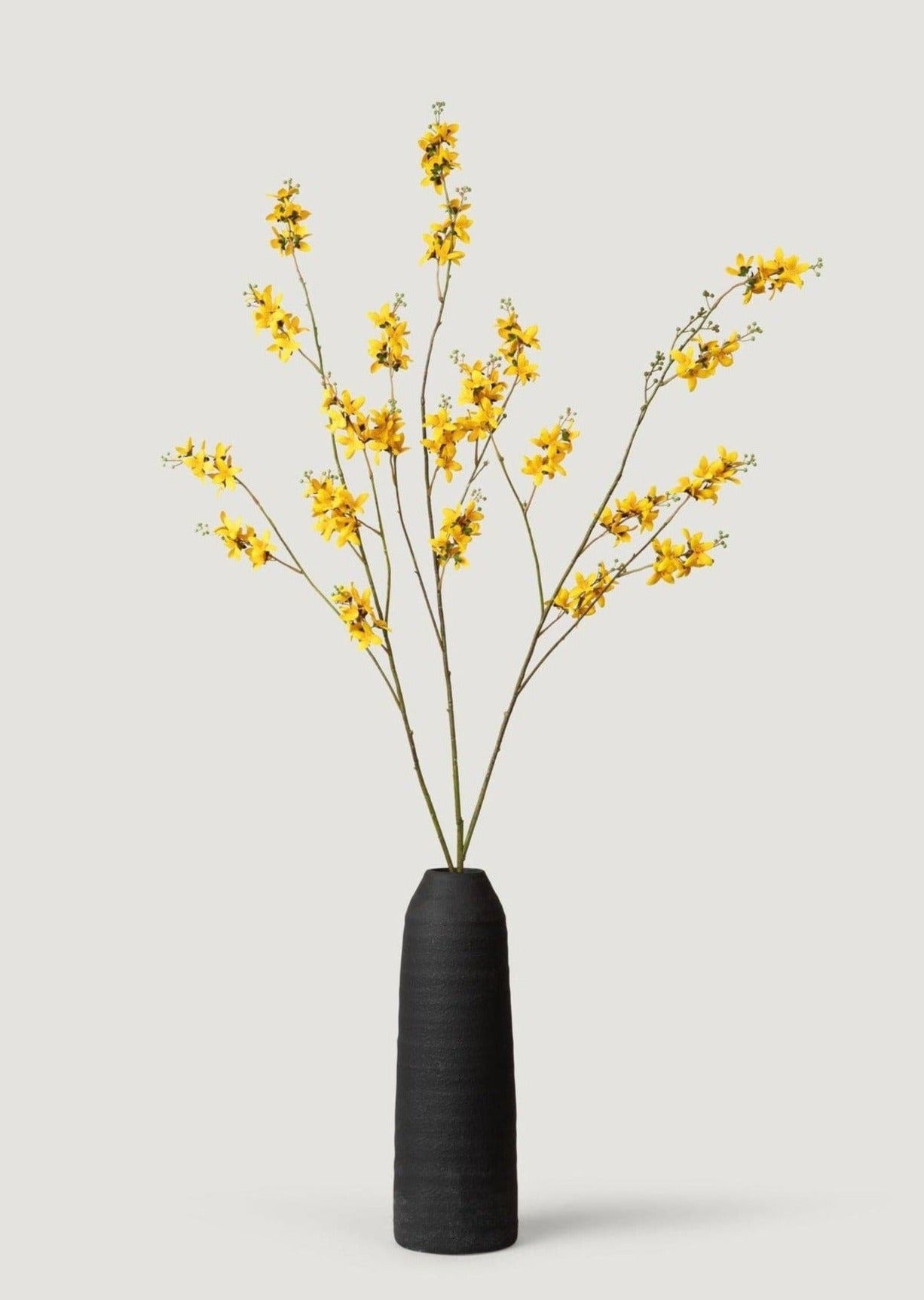 Tall Geena Ceramic Black Vase Styled with Faux Forsythia Branches at afloral