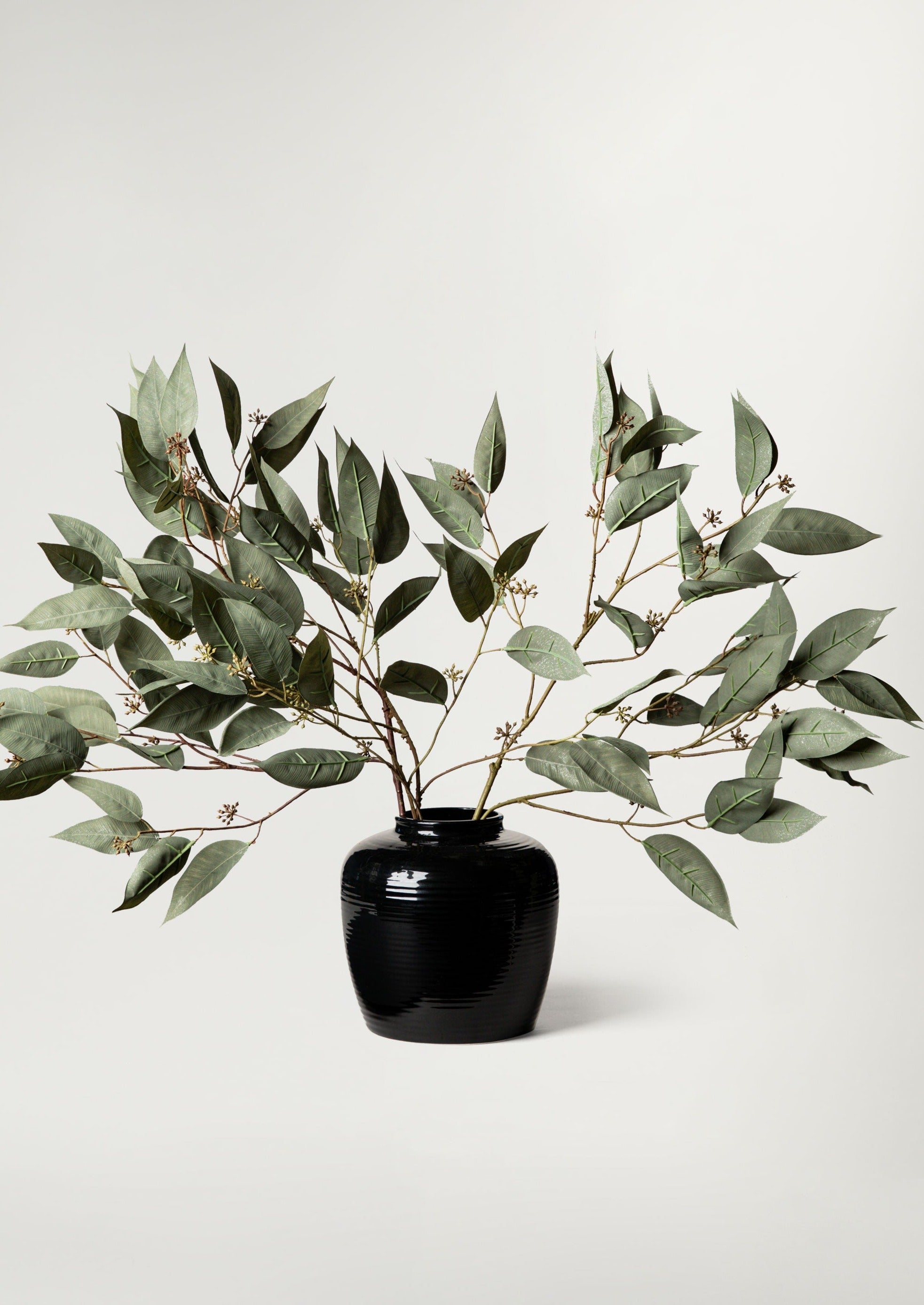 Artificial Seeded Eucalyptus Branches in Glazed Noir Vase
