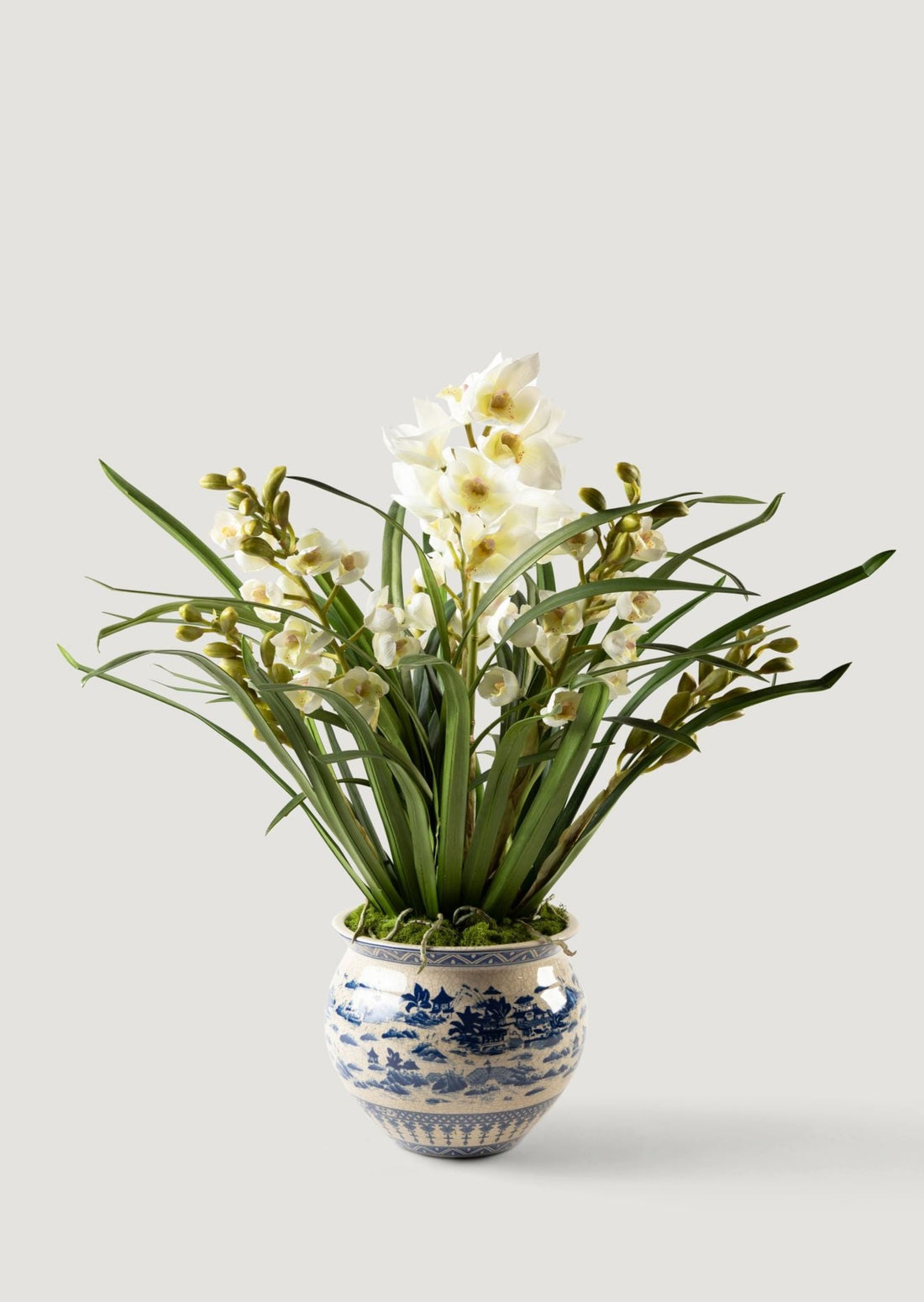 faux white orchids in blue and cream ceramic pot for luxe interior design