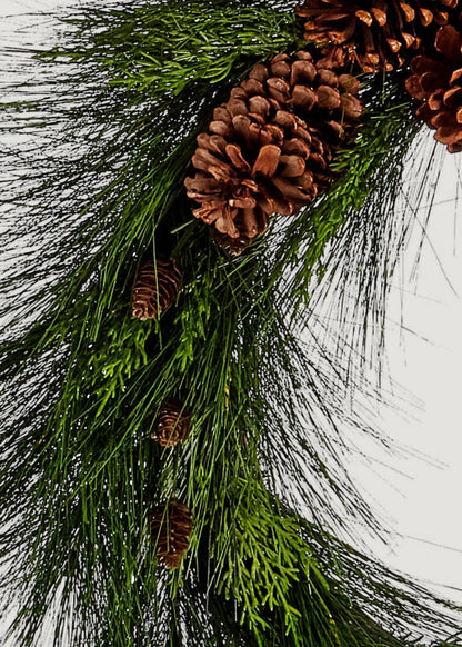 Close-up of long needle pine wreath with pine cones