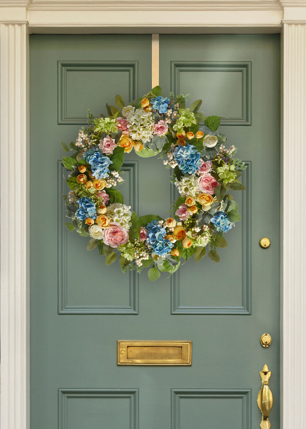 Artificial Spring Blooming Wreath on a Green Door