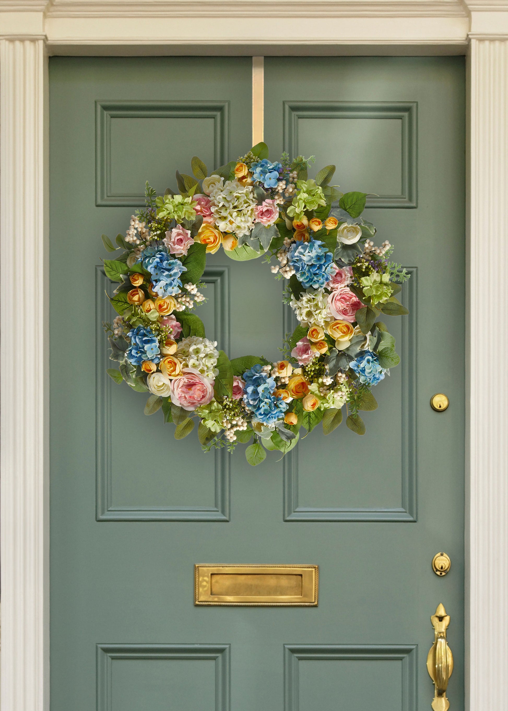 Artificial Spring Blooming Wreath on a Green Door