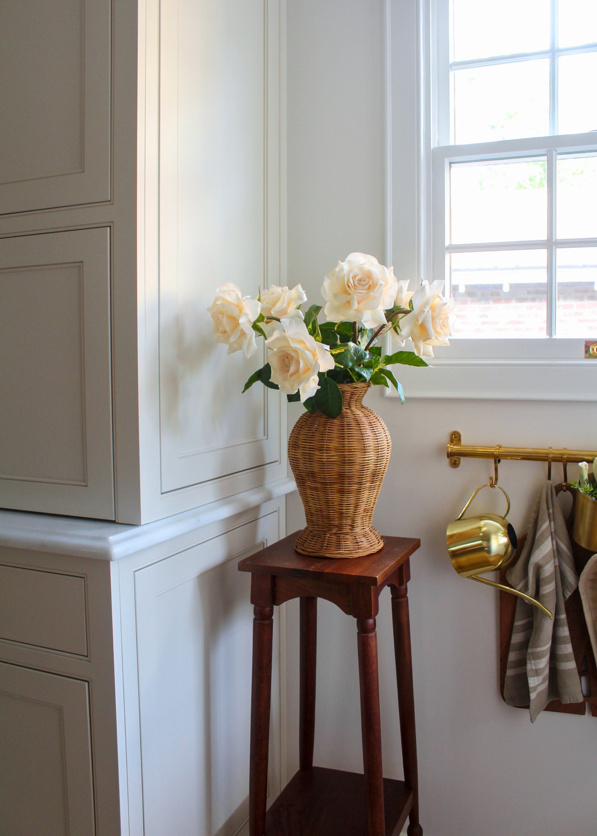Beige Roses Arranged in a Wicker Vase