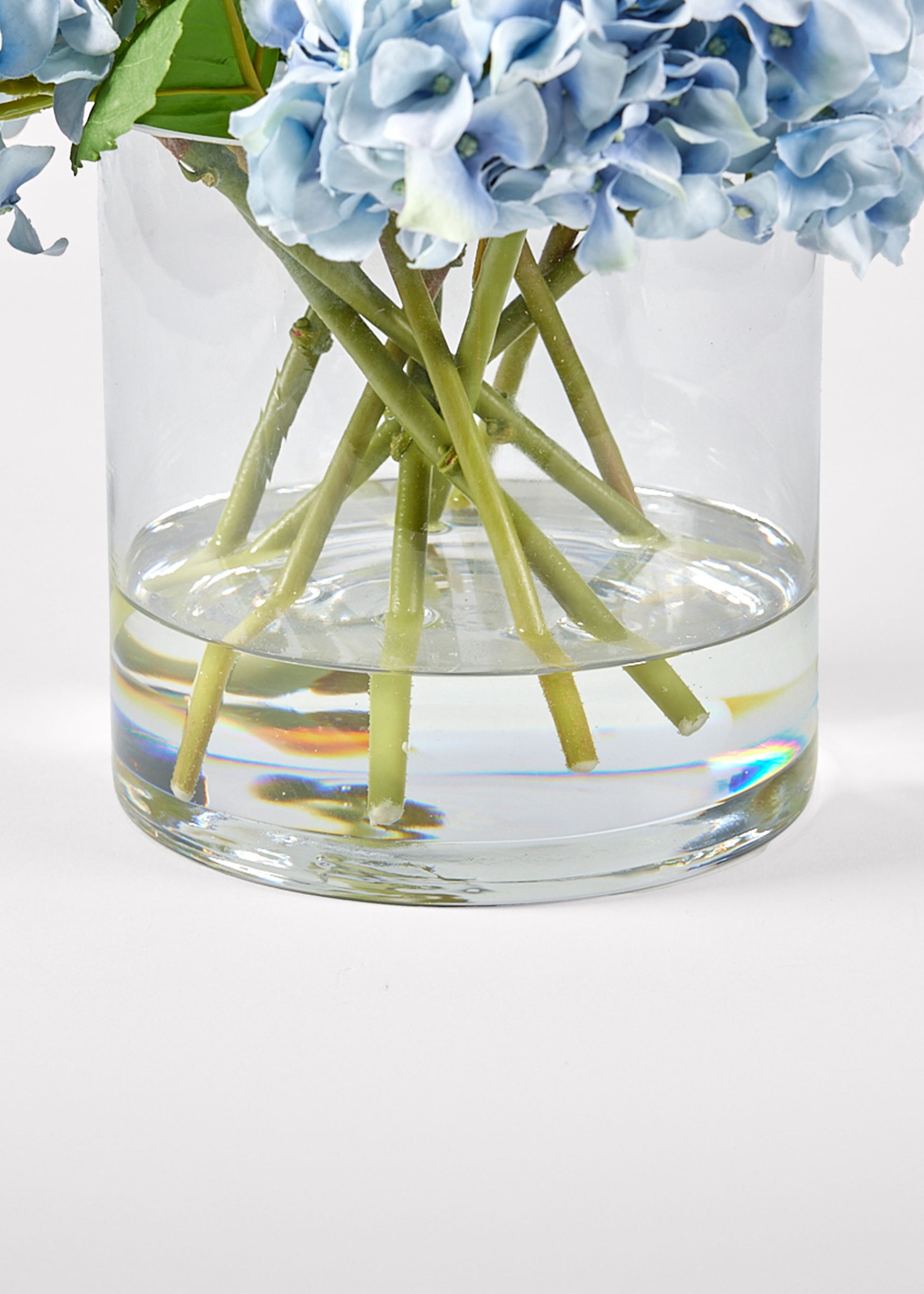 Close Up View of Acrylic Water in Blue Hydrangea Arrangement