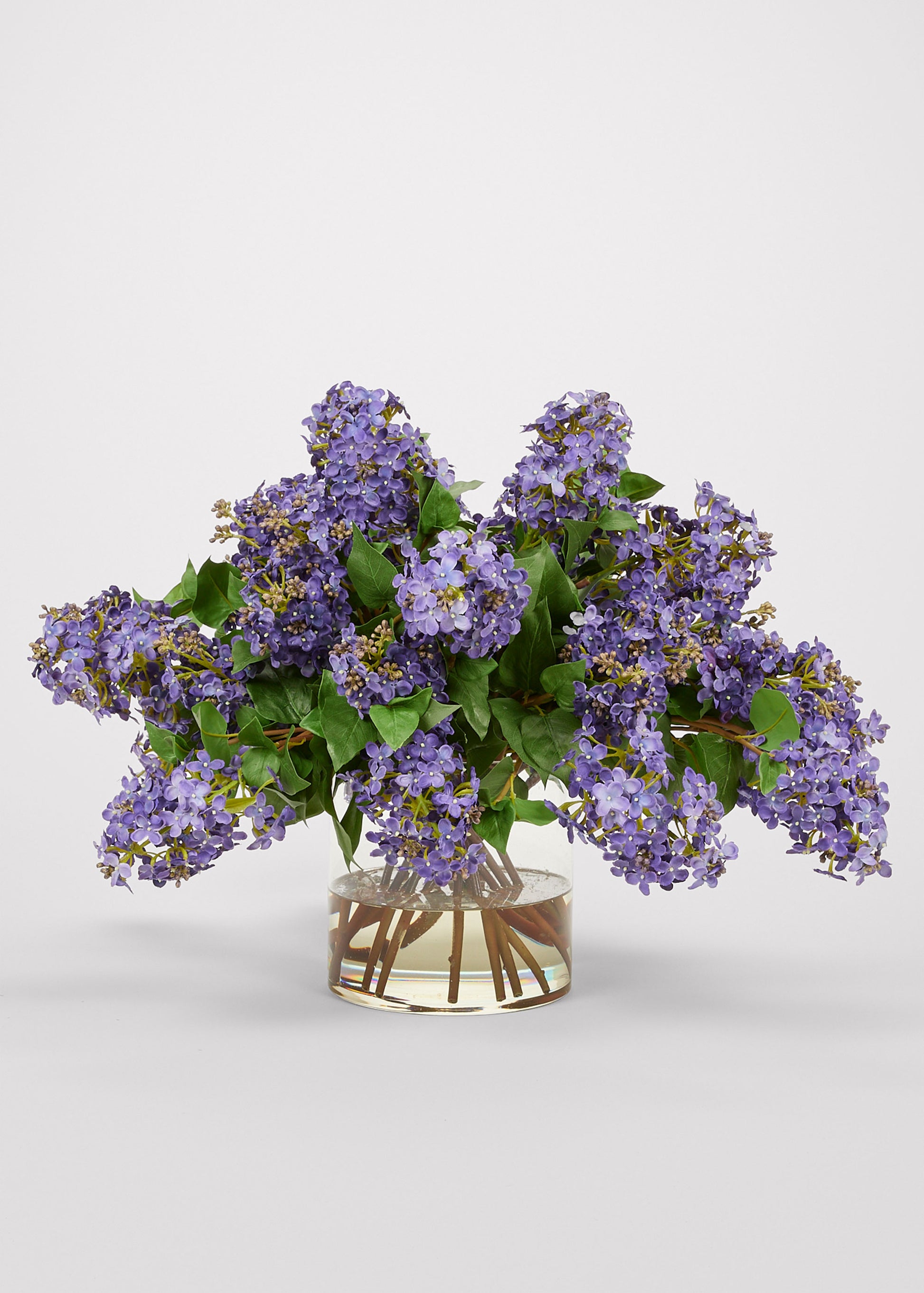 Purple Artificial Lilac Flower Arrangement in Glass Vase at Afloral