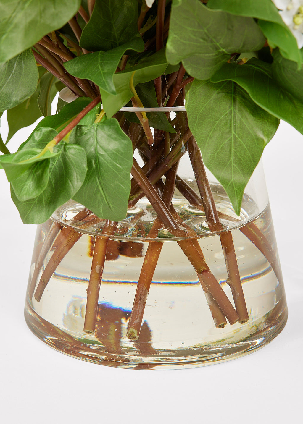 Glass Vase and Acrylic Water of Faux Lilac Arrangement in Closeup View