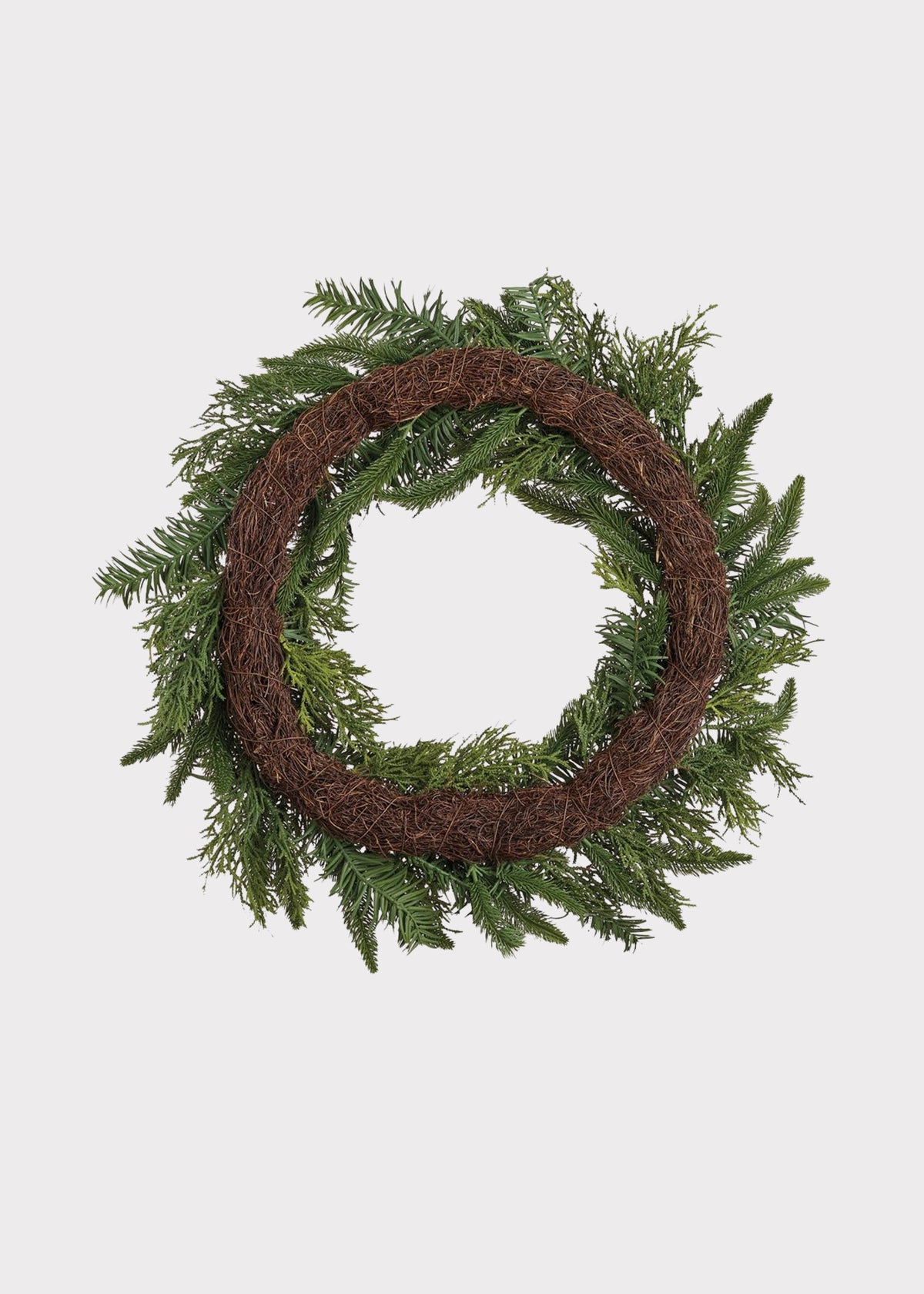 Back of an Artificial Pine and Juniper Holiday Greens Wreath