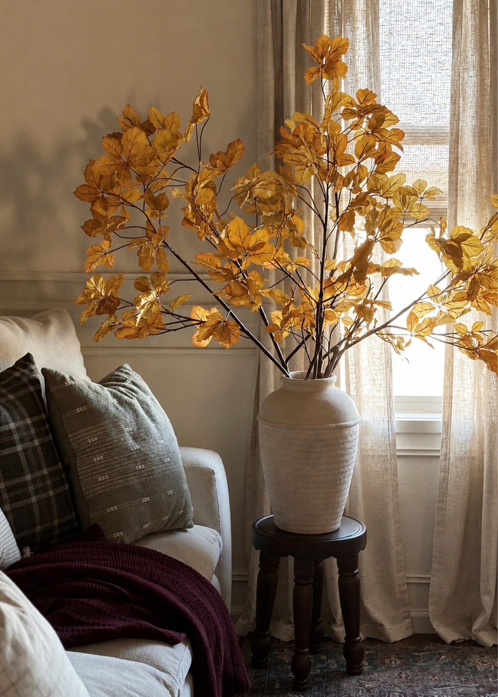 artificial chestnut branches arranged in vase