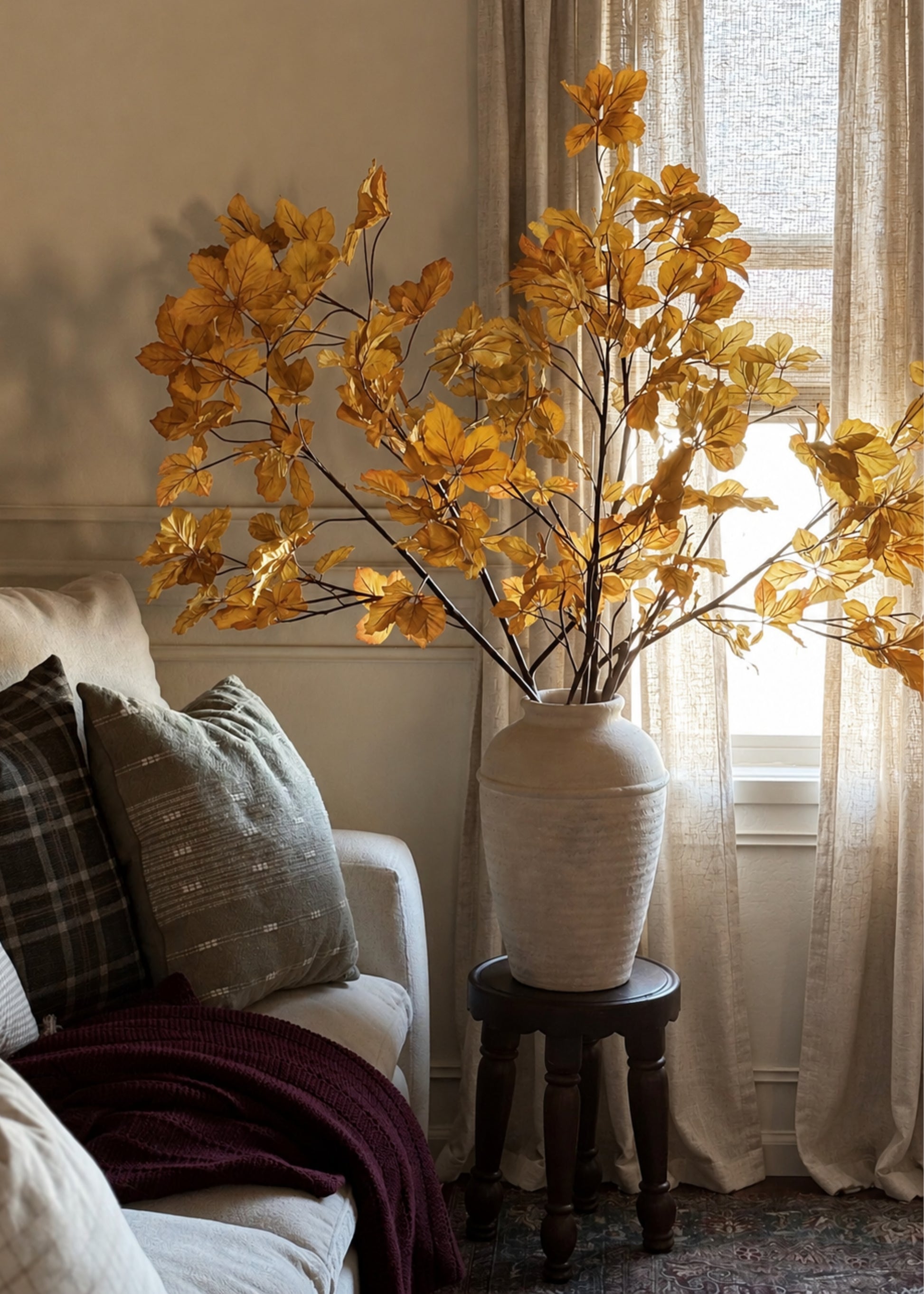 artificial chestnut branches arranged in vase