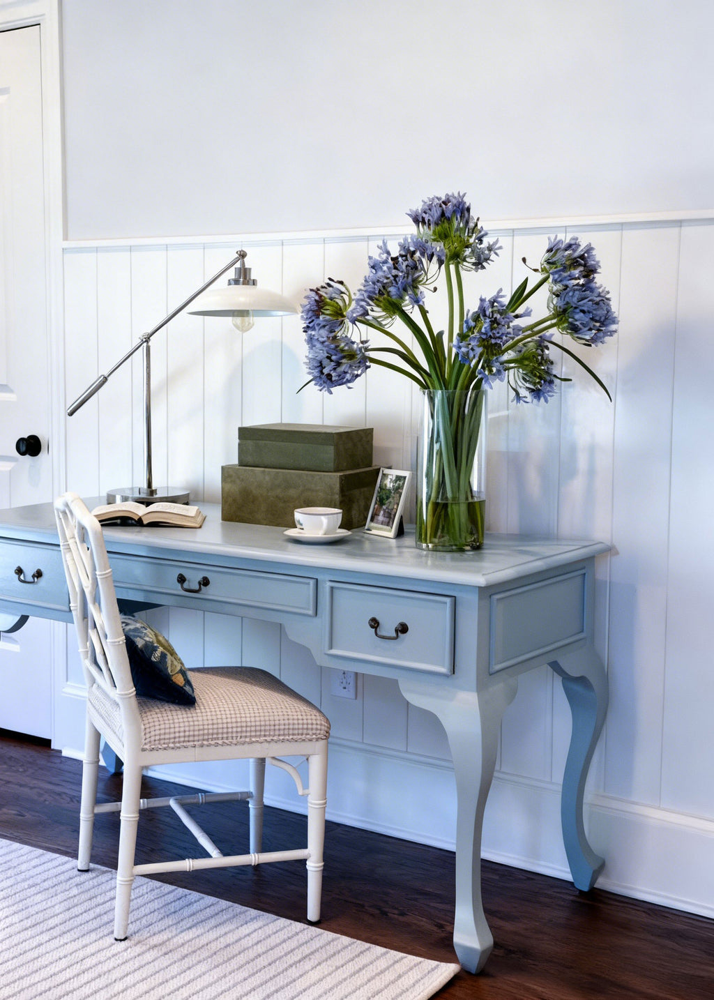 artificial agapanthus arrangement styled on a desk