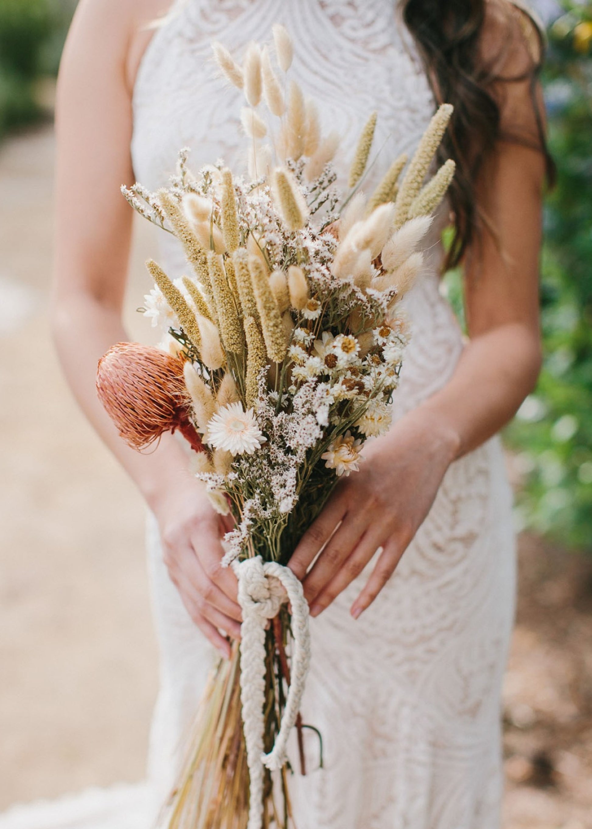 Bouquet of dried flowers with statice, ammobium, and bunny tails