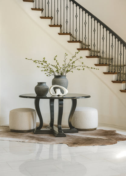 foyer styled with green budding branches in decorative vase