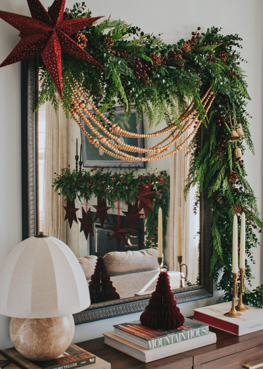 Mirror Decorated with Berry, Eucalyptus, and Cedar Garlands