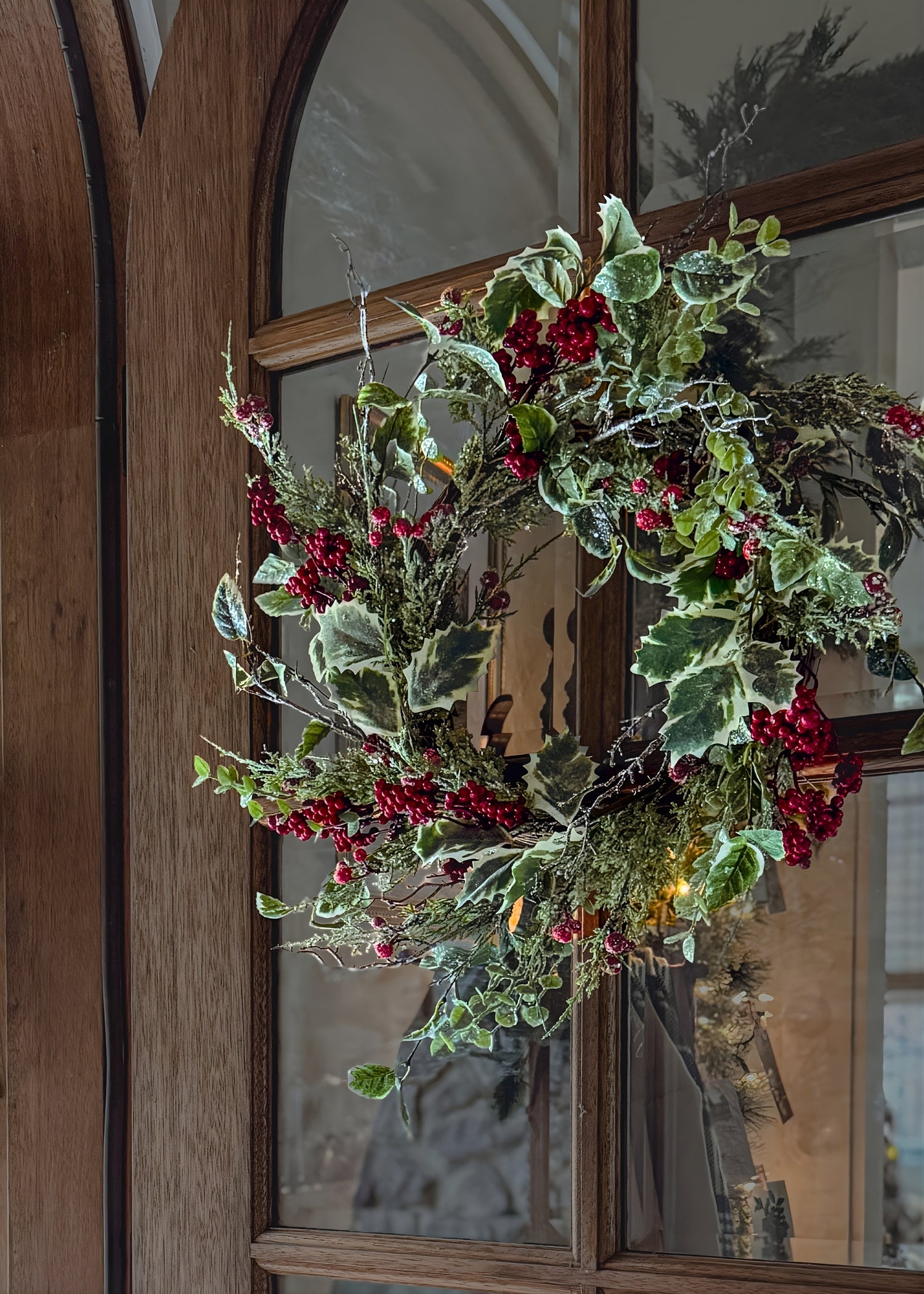 decorative christmas holly wreath on door