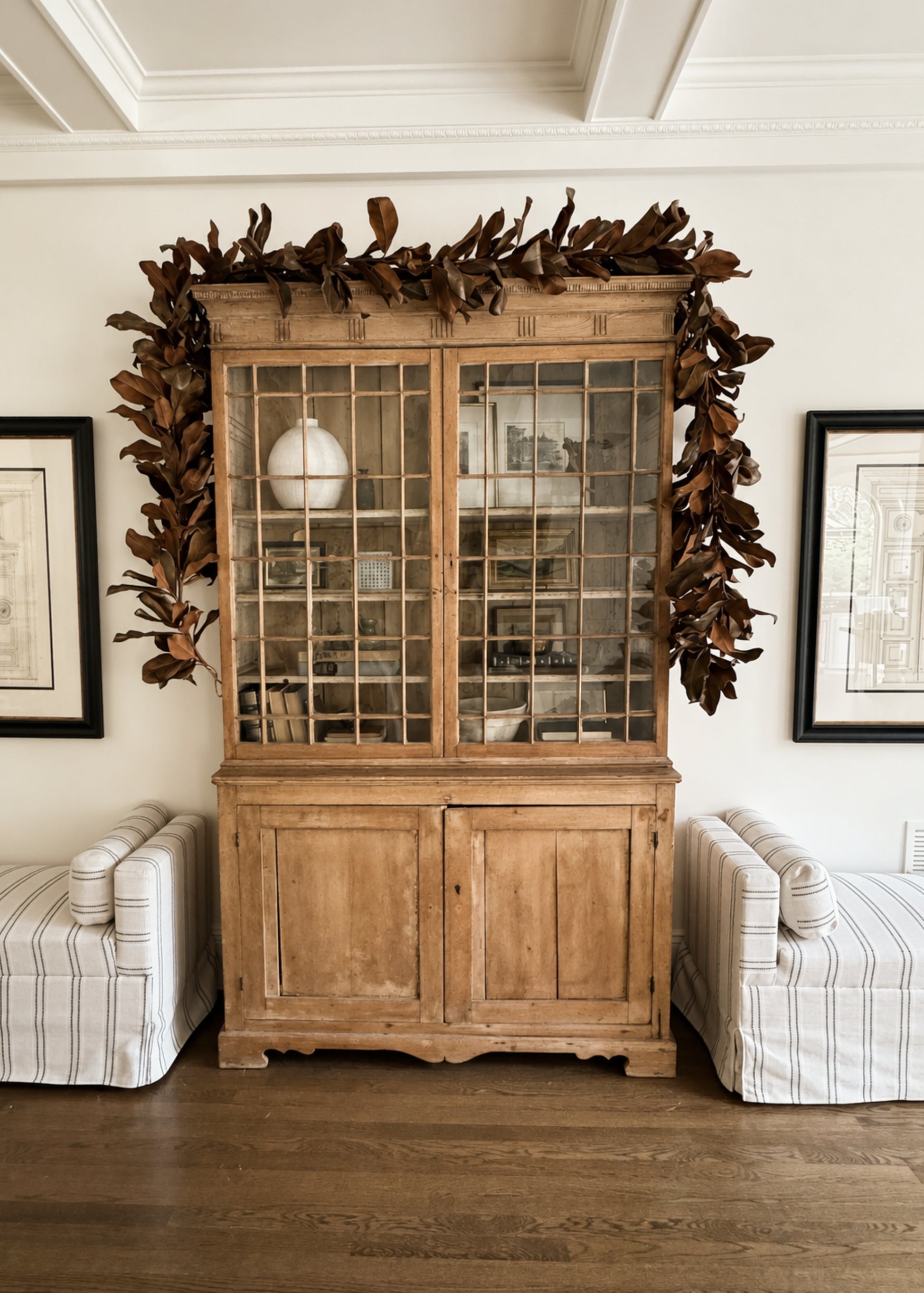 Magnolia Garland Decorating a Cabinet
