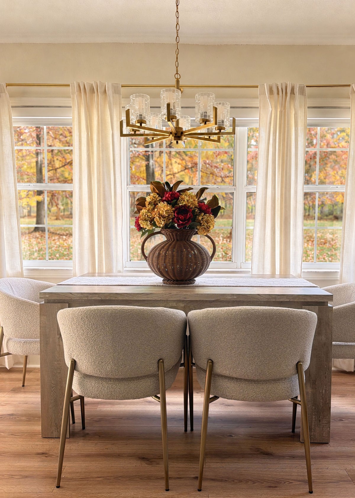 faux peony and hydrangea arrangement on a table for fall