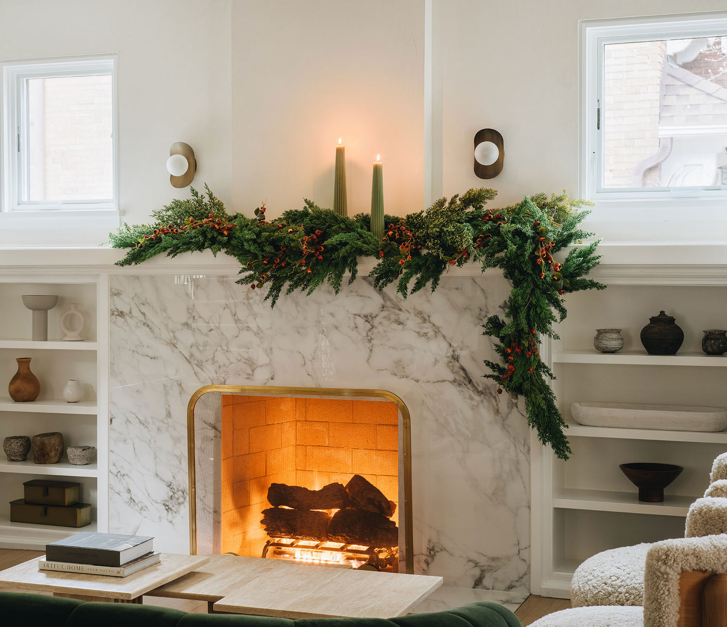 Christmas Mantel Decorated with Deluxe Cedar Garland, Pillar Candles, and Holiday Berries
