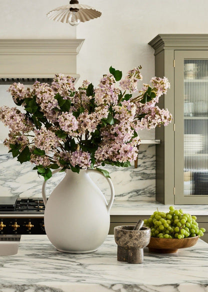Pale Lavender Artificial Lilacs Styled in Double Handled Jug Vase at afloral