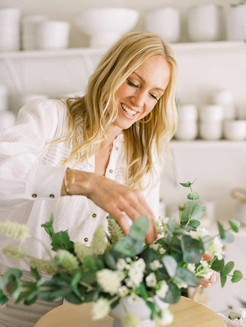 Jen Lagedrost Cavender of Nectar & Bloom arranges wedding flowers.
