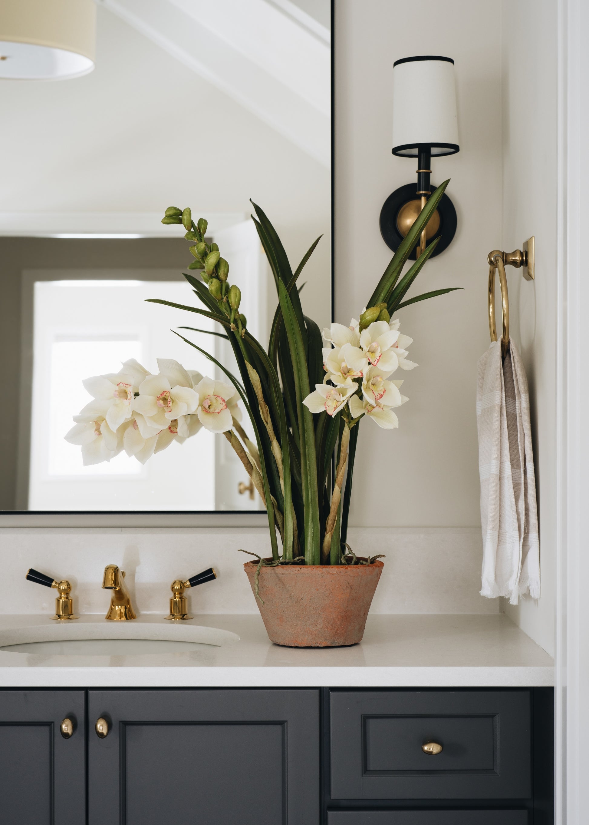 Afloral Arrangement of Fake Orchids for the Bathroom