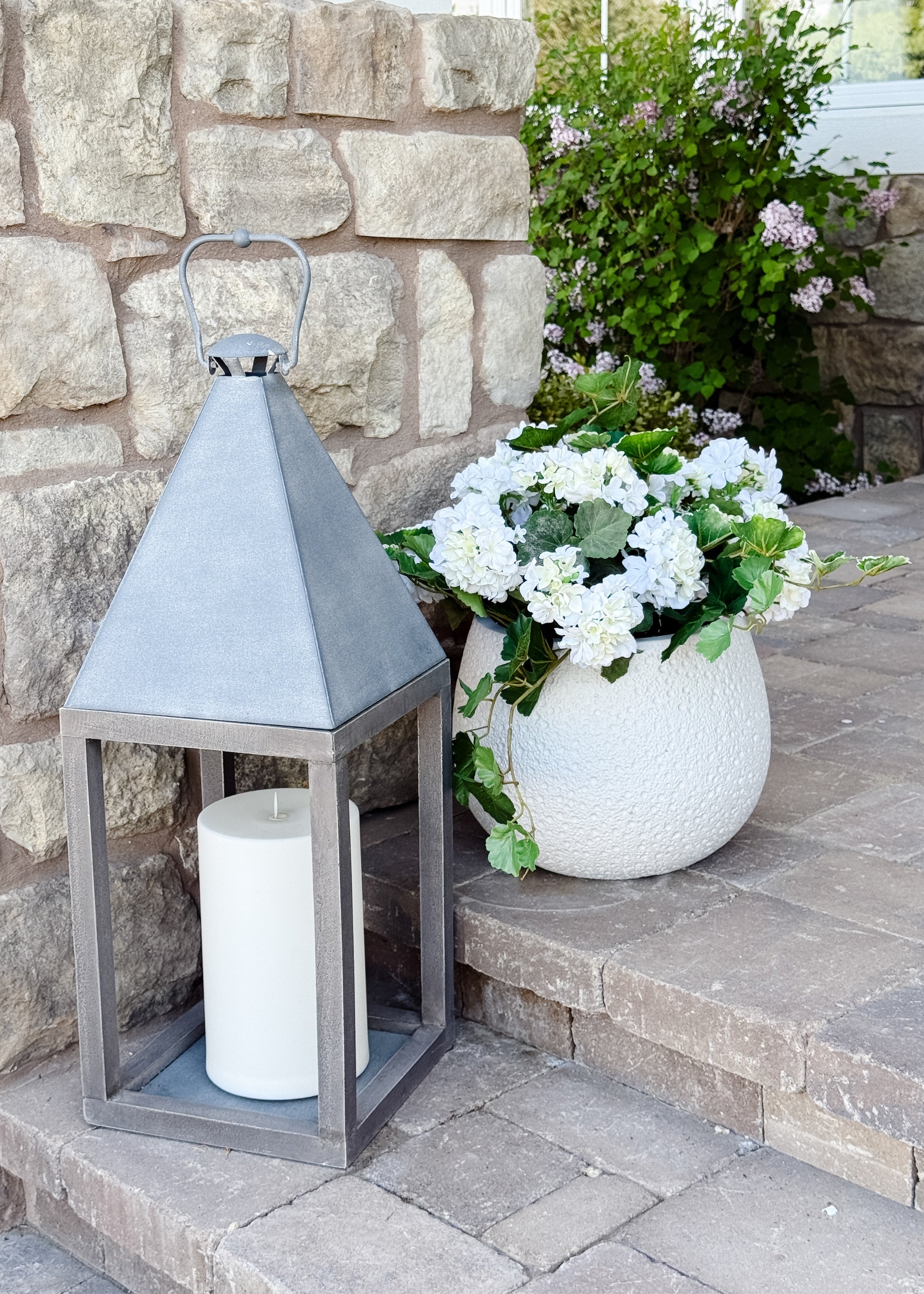 Outdoor Geraniums Styled on a Front Porch