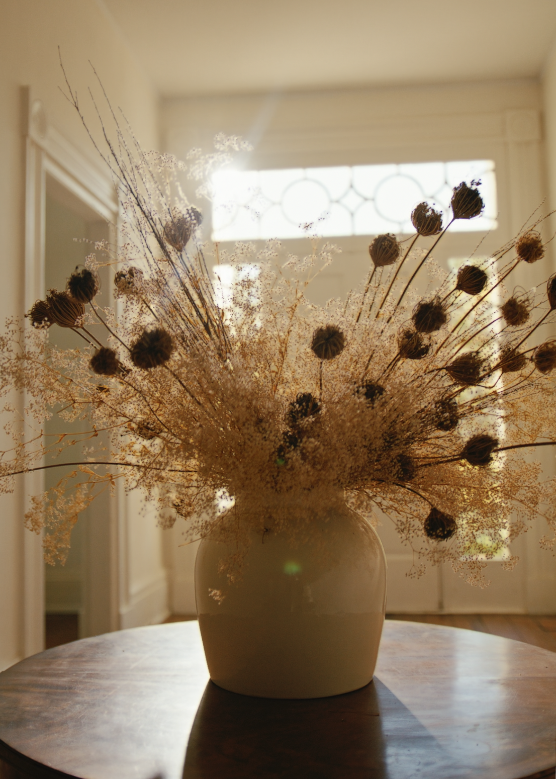 afloral glossy vase with dried queen anne's lace and gypsophila 