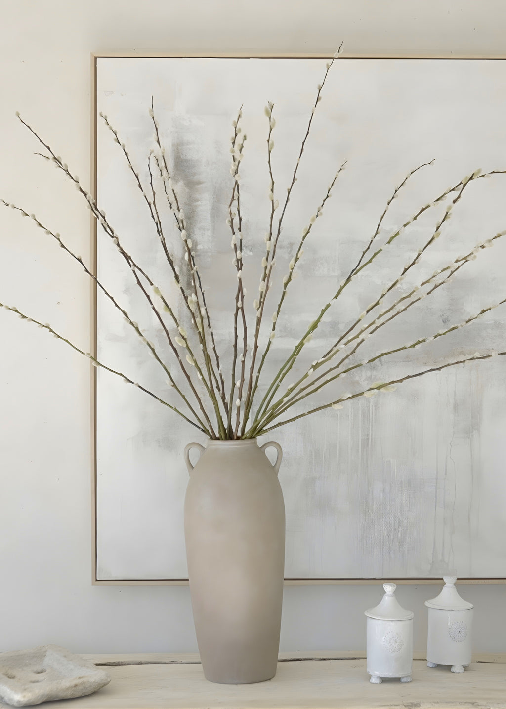 Styling fresh pussy willows in a tall terracotta vase