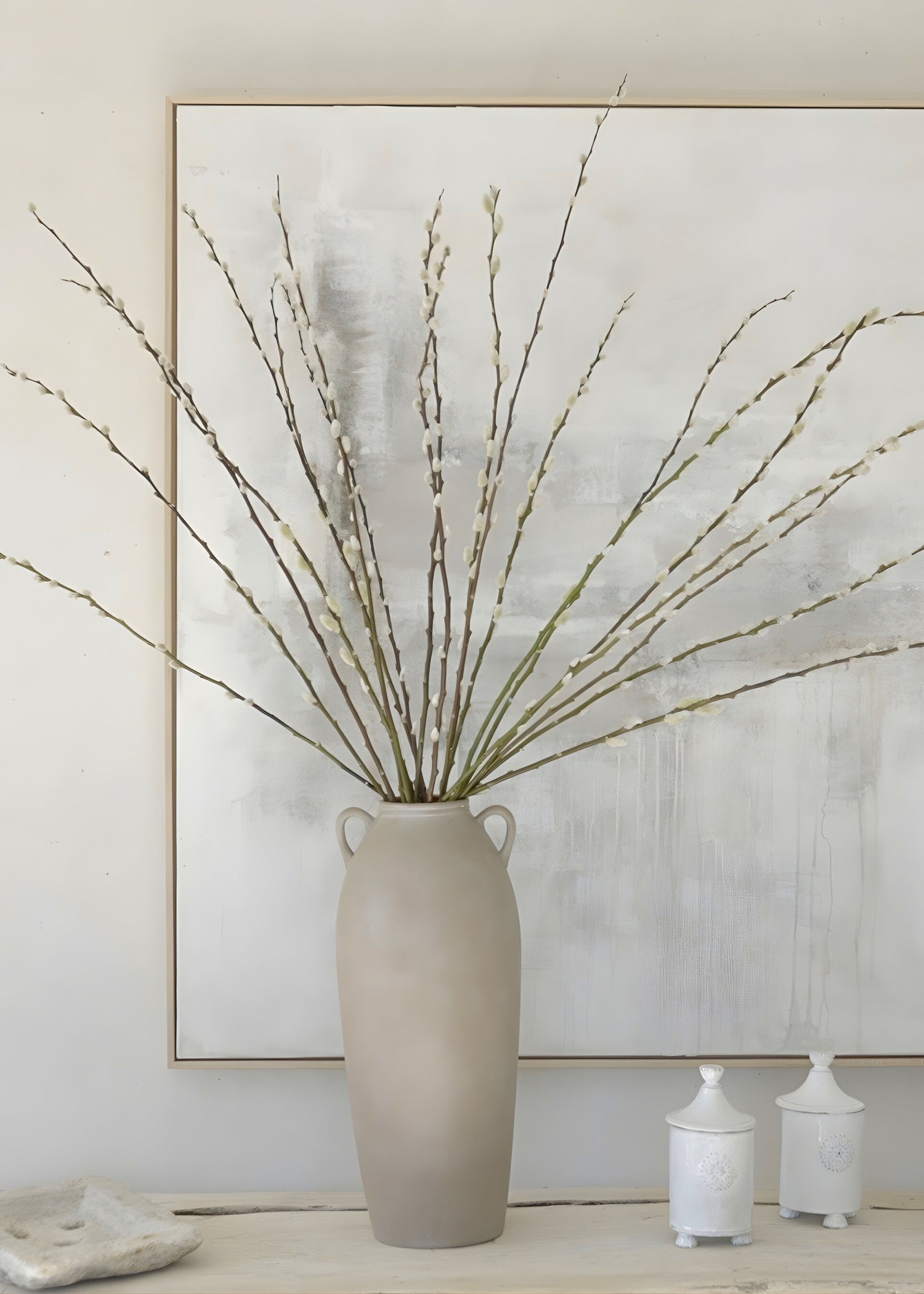 Styling fresh pussy willows in a tall terracotta vase