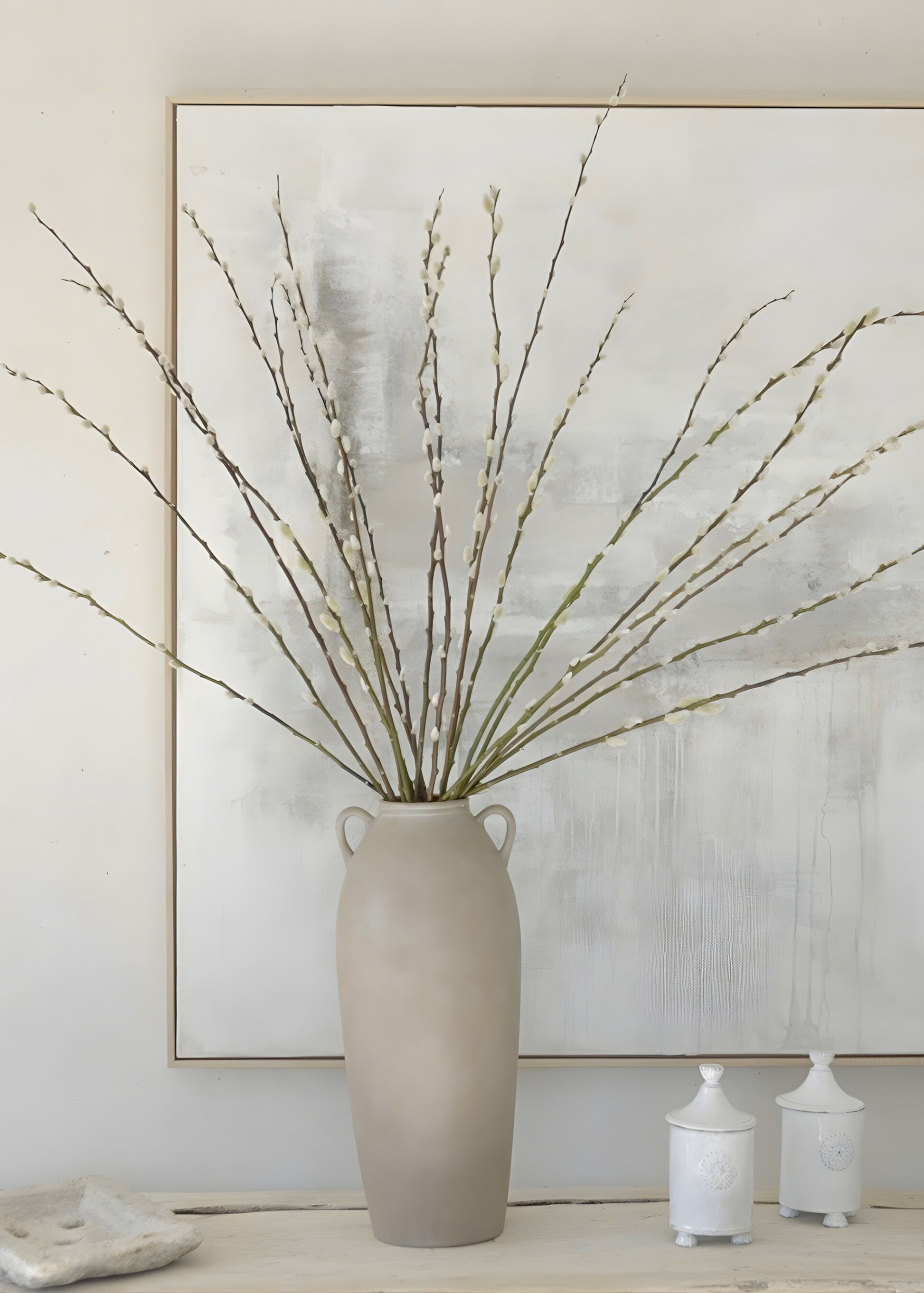 Styling fresh pussy willows in a tall terracotta vase