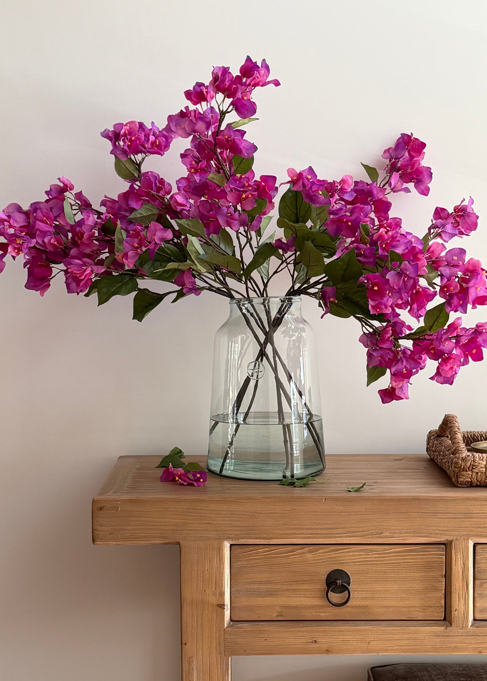 arranging purple artificial bougainvillea flowers