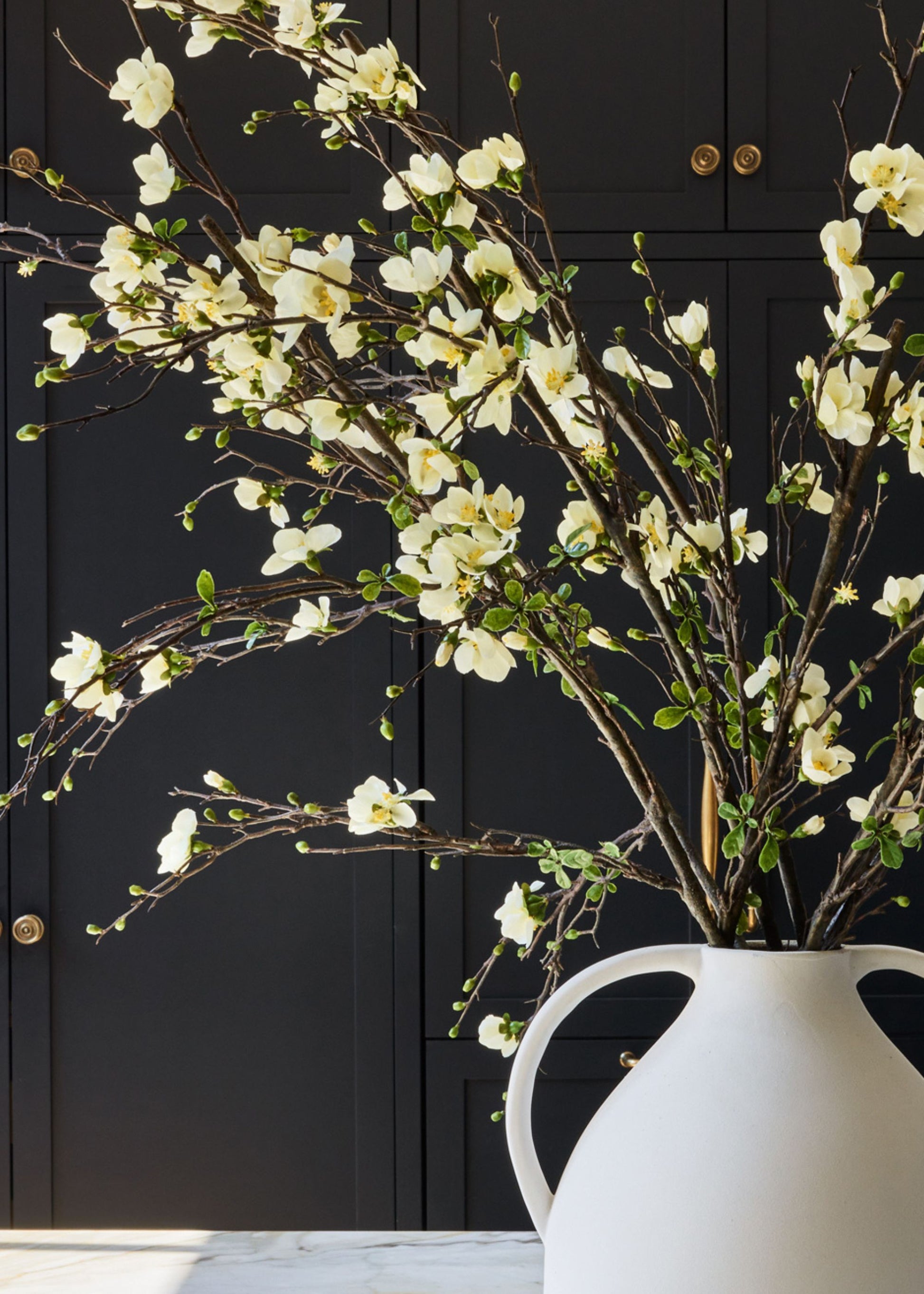 blossoms branches styled in Afloral jug vase