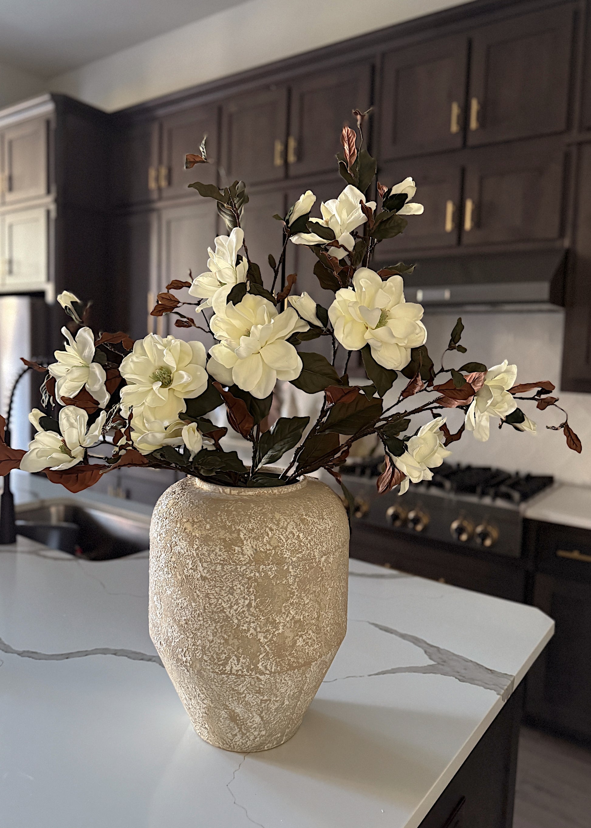 arranging artificial magnolia stems