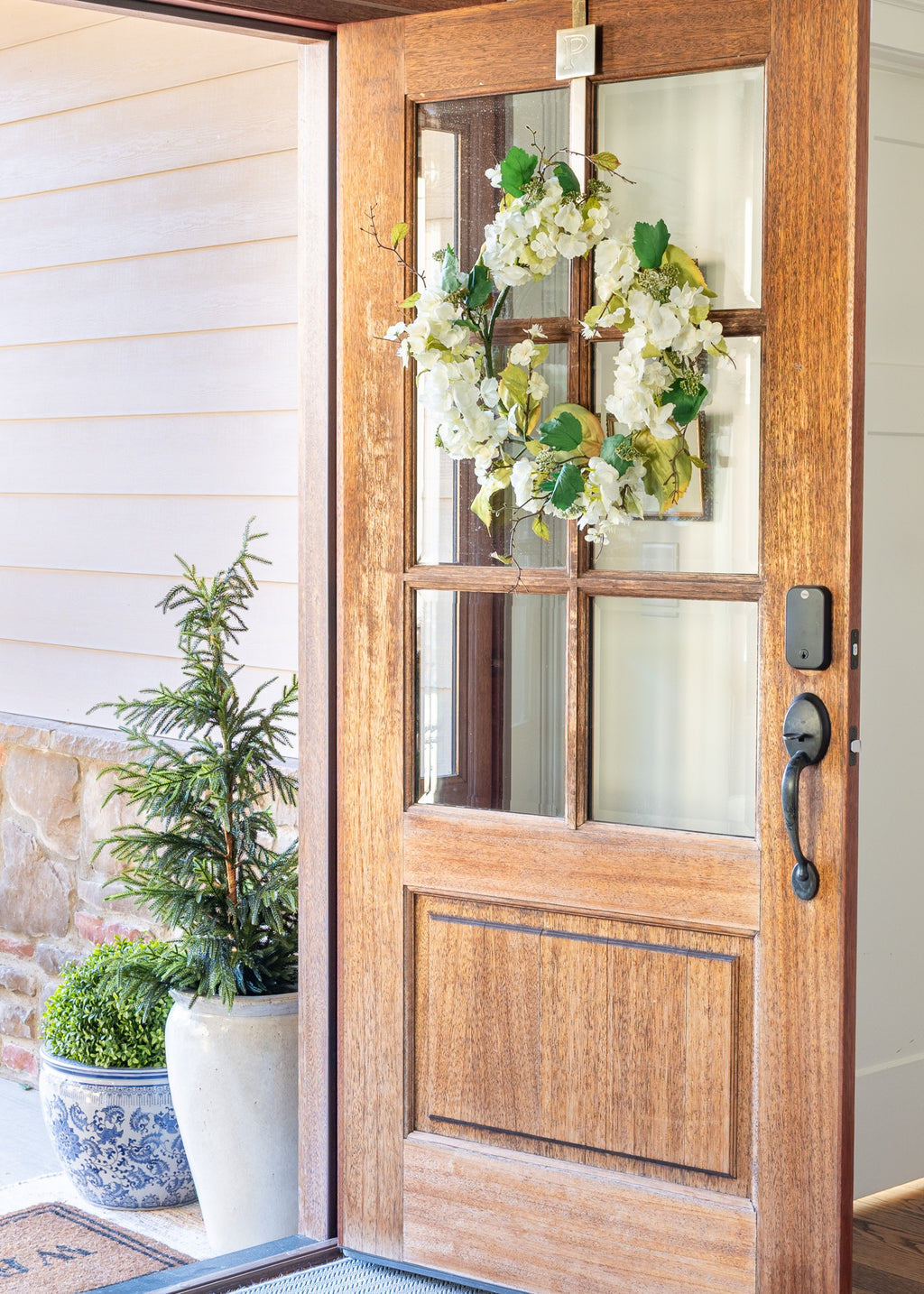 Front door with spring door wreath