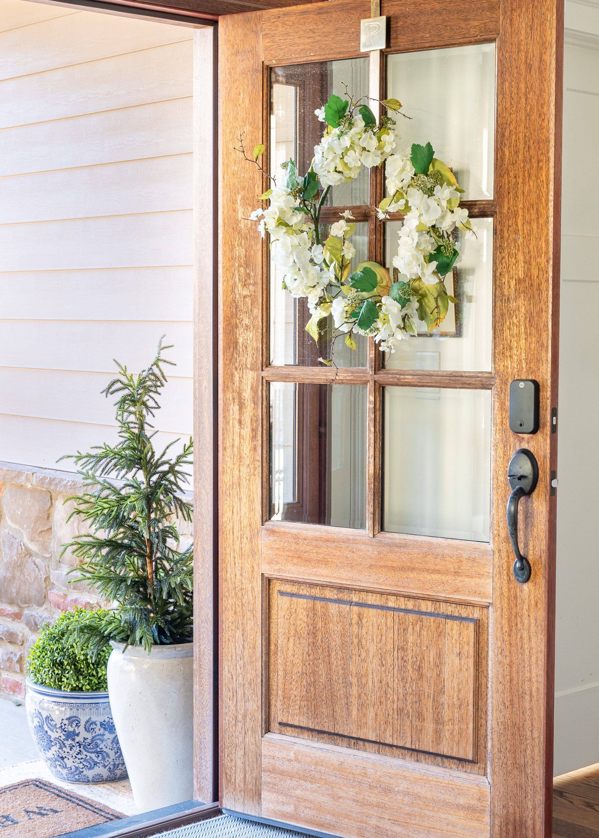 Front door with spring door wreath