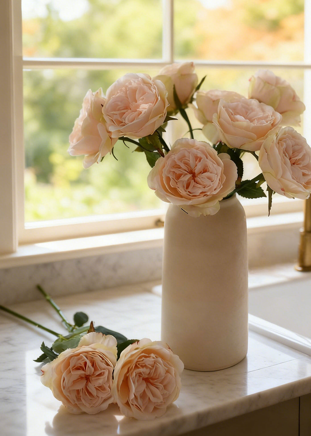 vase of silk apricot rose stems