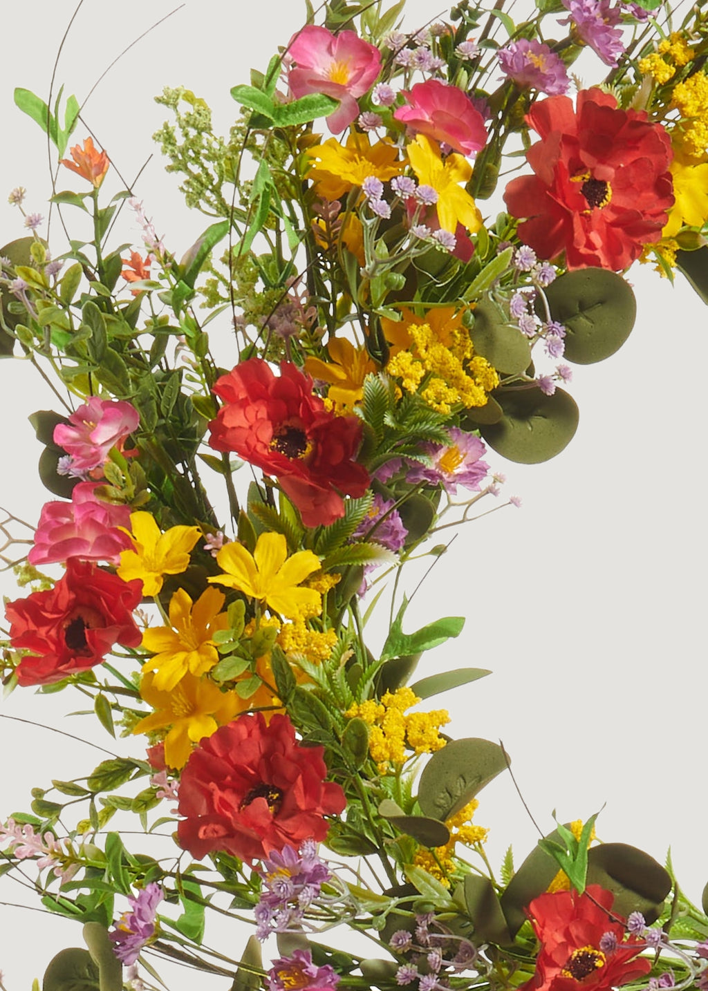 Close-up of poppy and blossom wreath