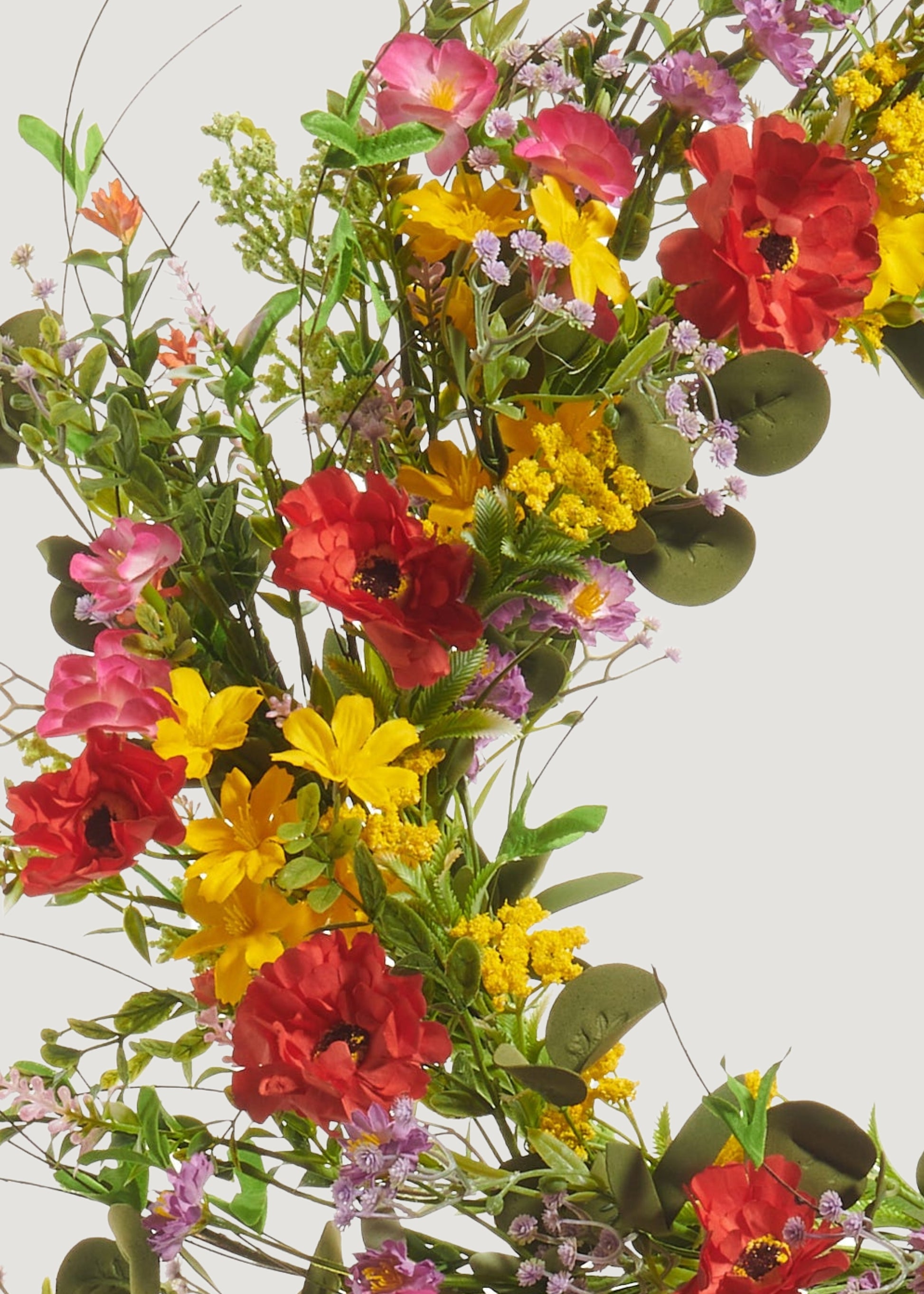 Close-up of poppy and blossom wreath
