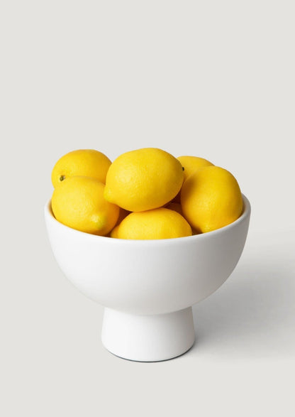 Artificial Lemons in a Large White Ceramic Compote
