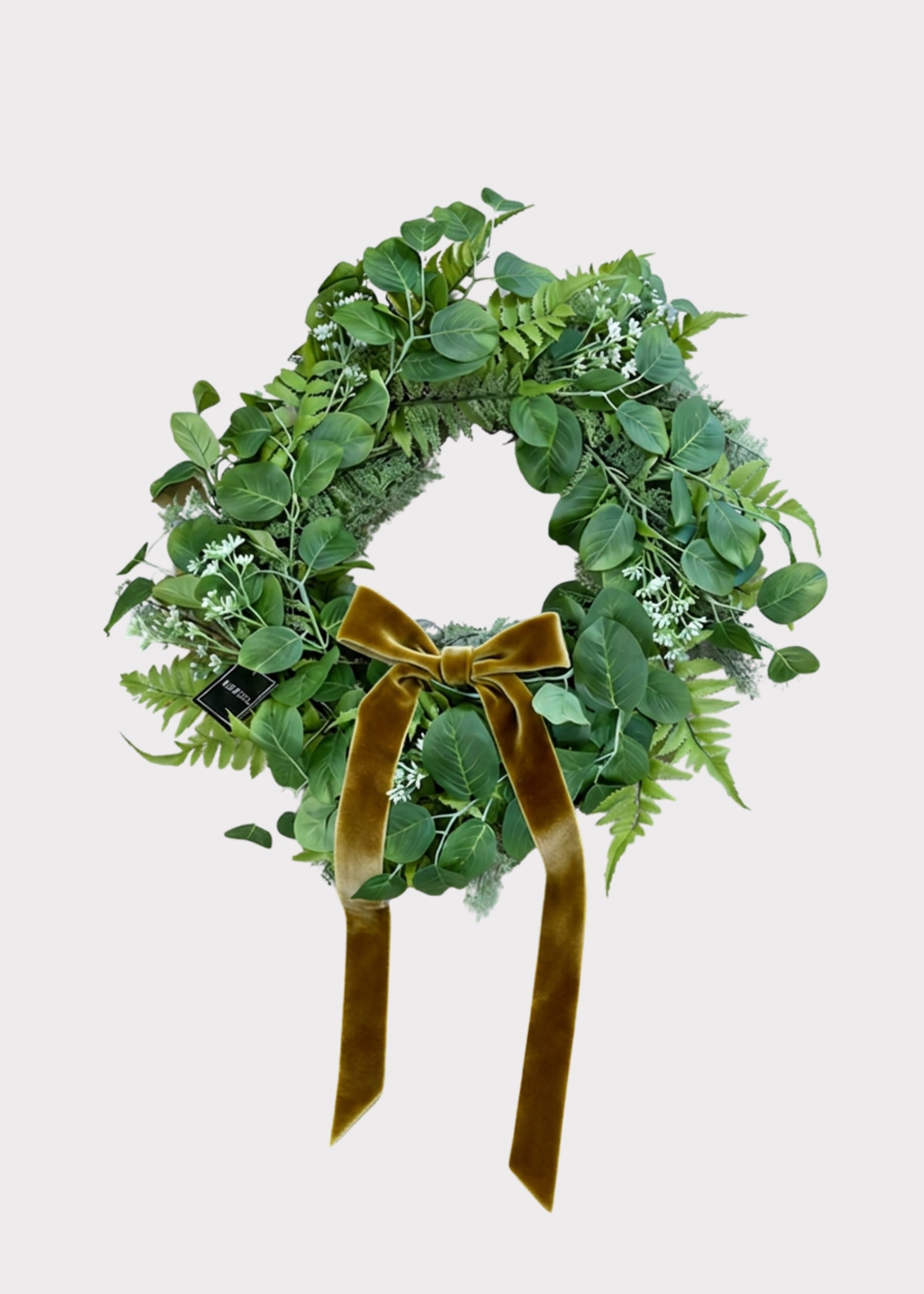 Artificial foliage wreath with bow