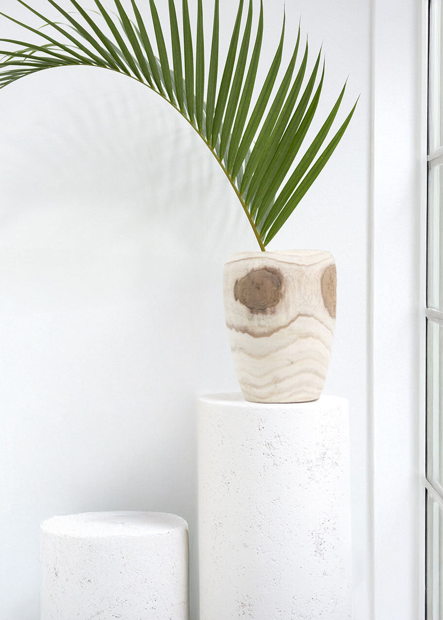 Decorative wood vase with a palm leaf 