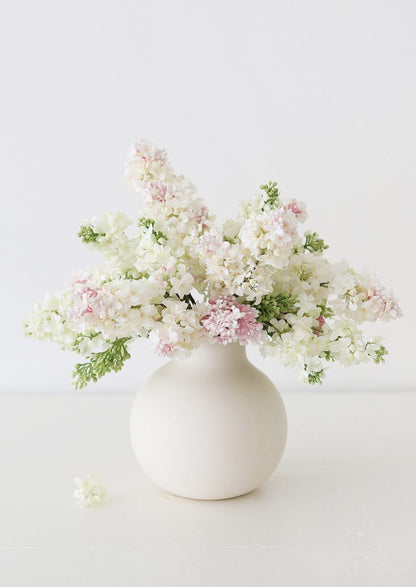 Cream and Pink Lilacs in White Round Vase at afloral