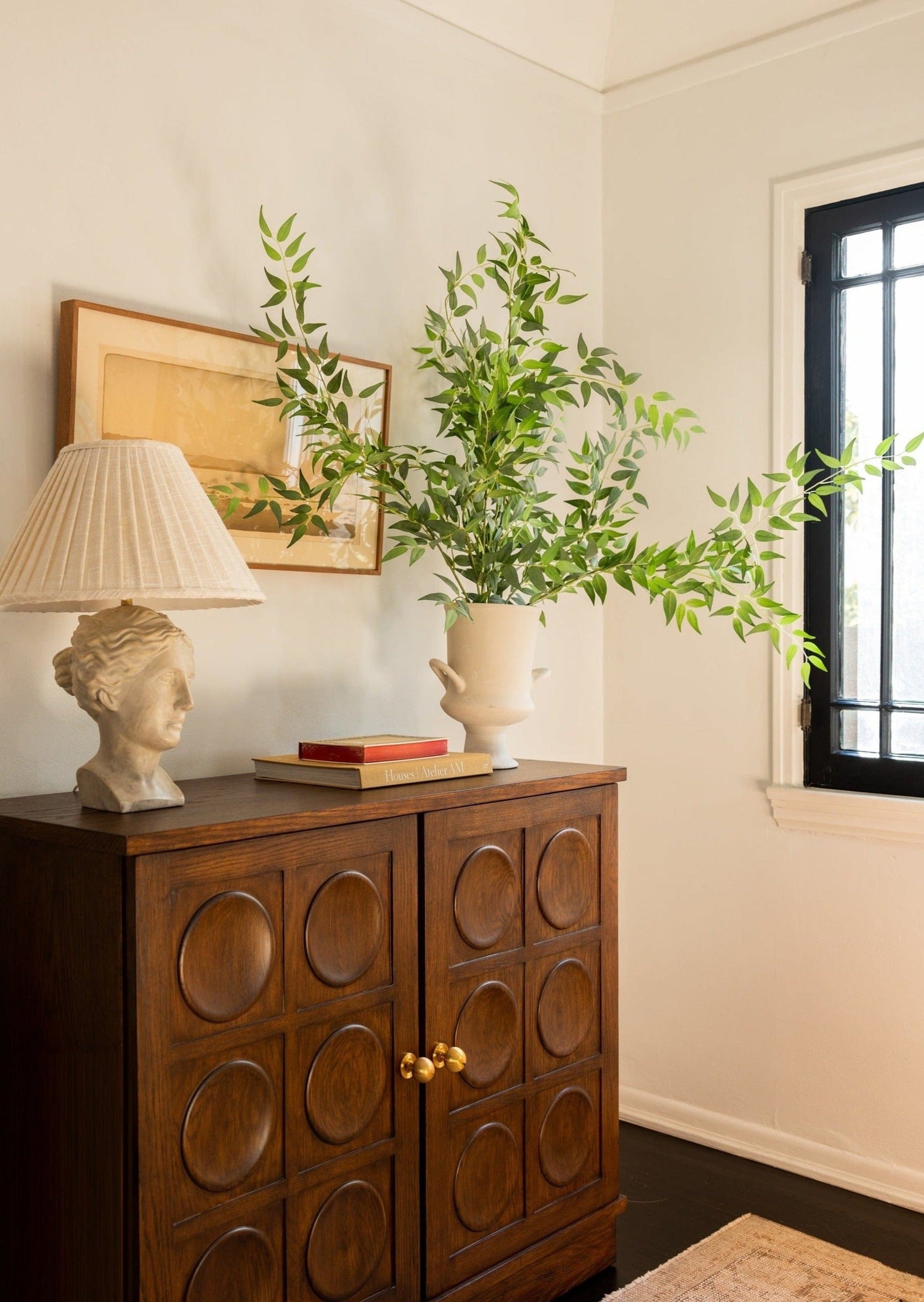 Afloral Artificial Ruscus Spray Styled in White Urn Vase