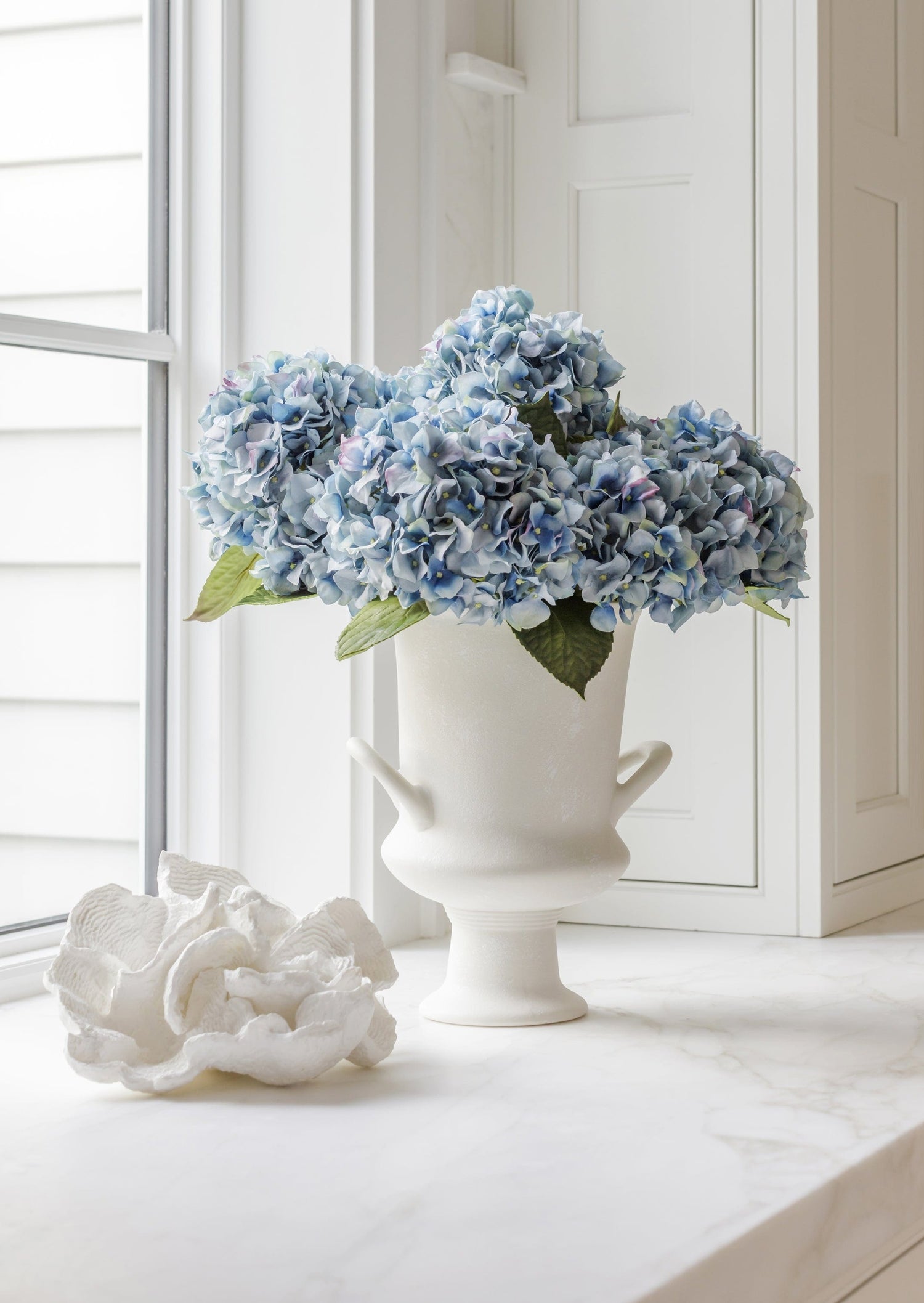 Blue Faux Hydrangeas Styled in White Urn Vase