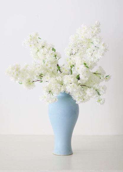 White Cherry Blossom Flowers in Blue Vase