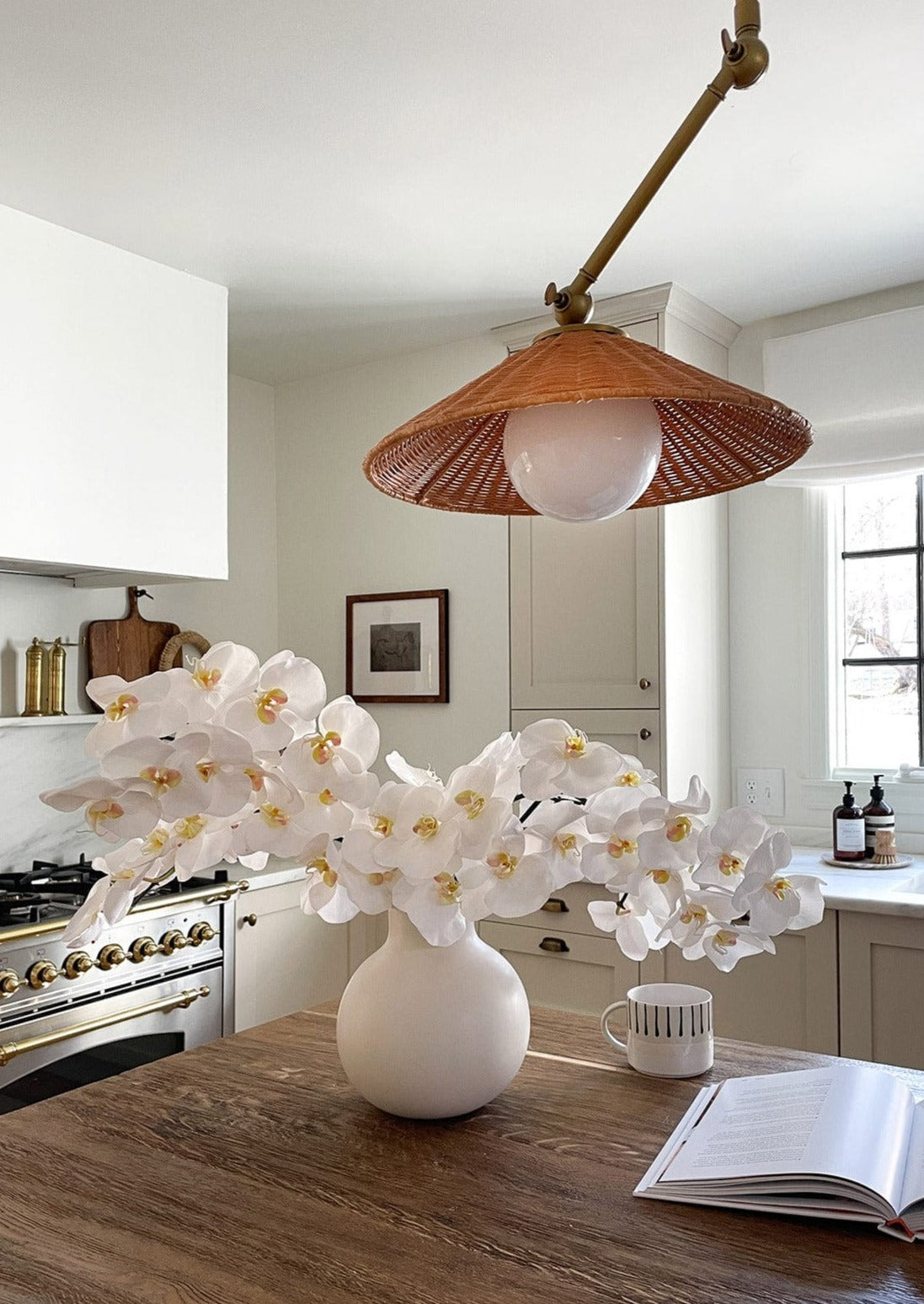 Stunning White Orchids Styled in Round Creamy Vase