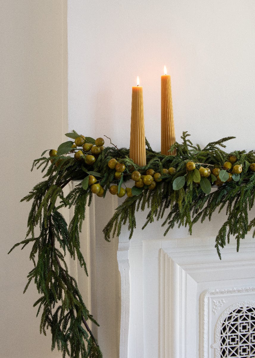 Yellow Taper Candle Styled with Afloral Faux Winter Pine Garland